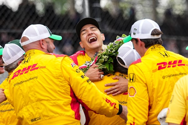 Alex Palou, of Spain, celebrates with his crew after winning the Indianapolis 500 auto race at Indianapolis Motor Speedway in Indianapolis, Sunday, May 25, 2025. (AP Photo/AJ Mast)