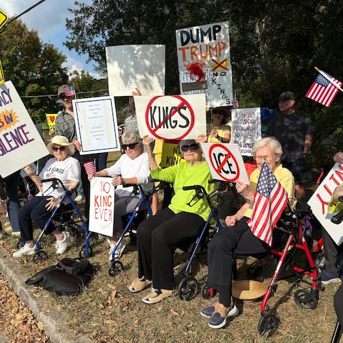 A group of DeKalb County seniors who call themselves "The Walker Brigade" lined Clairmont Road on Saturday afternoon to protest President Donald Trump and his administration's policies.
(Shaddi Abusaid/AJC)