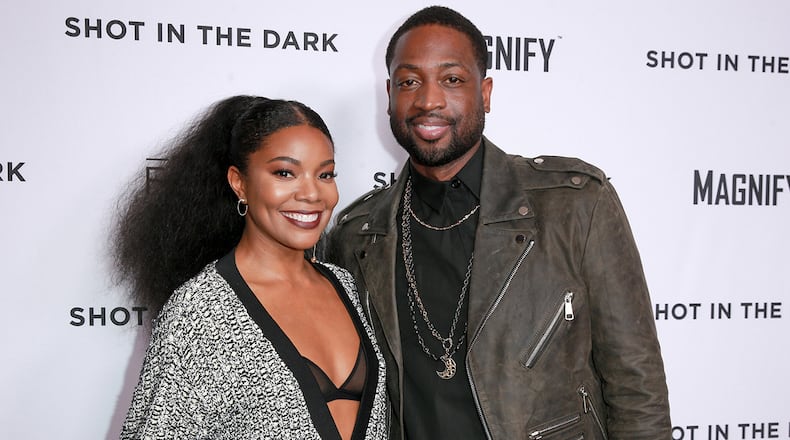 Gabrielle Union (L) and Dwyane Wade donated $200,000 to help send students to the March For Our Lives gun control rally in Washington D.C. (Photo by Rich Fury/Getty Images)