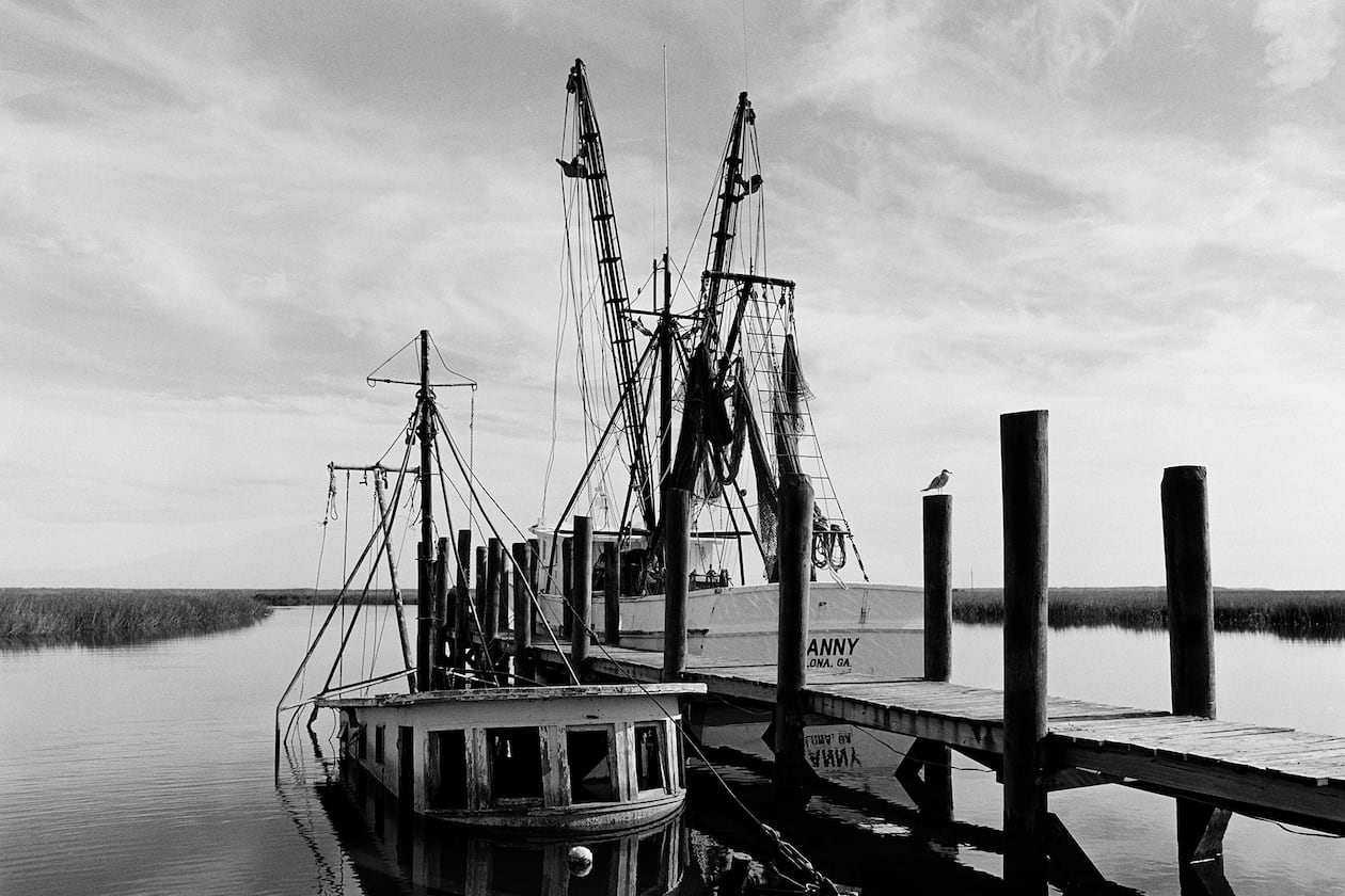 "Sunken Shrimp Boat," a 1987 photograph by Jack Leigh. Photos of Georgia's coast by Leigh and Parker Stewart are on display at Laney Contemporary, a Savannah gallery, until Aug. 1, 2026. (Courtesy of Jack Leigh/Laney Contemporary)