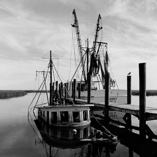 "Sunken Shrimp Boat," a 1987 photograph by Jack Leigh. Photos of Georgia's coast by Leigh and Parker Stewart are on display at Laney Contemporary, a Savannah gallery, until Aug. 1, 2026. (Courtesy of Jack Leigh/Laney Contemporary)