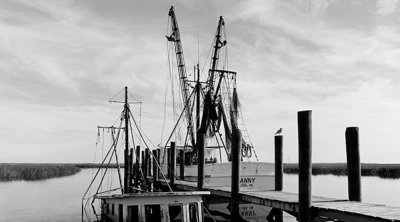 "Sunken Shrimp Boat," a 1987 photograph by Jack Leigh. Photos of Georgia's coast by Leigh and Parker Stewart are on display at Laney Contemporary, a Savannah gallery, until Aug. 1, 2026. (Courtesy of Jack Leigh/Laney Contemporary)