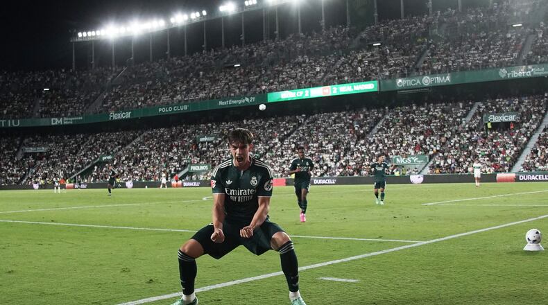 Real Madrid's Carlos Espi celebrates after scoring his sides third goal during the Spanish La Liga soccer match between Elche and Real Madrid in Elche, Spain, Tuesday, Sept. 15, 2026. (AP Photo/Alberto Saiz)