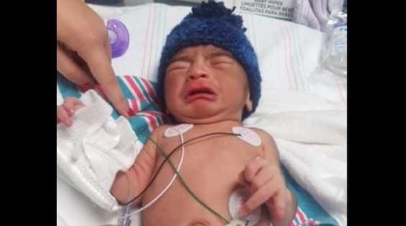 Chamblee police say this newborn boy was left outside a clinic in a gym bag.
