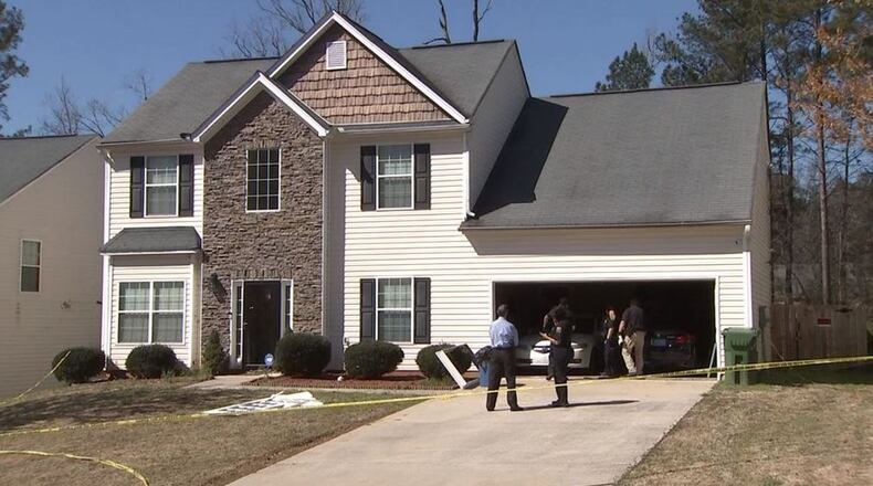 A man was found shot to death in the garage of this house in south Fulton County.