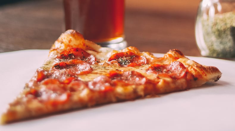 A local news report claims a man who crashed into a pizza restaurant walked out with a pizza, but police only say a mechanical error may have contributed to the crash.