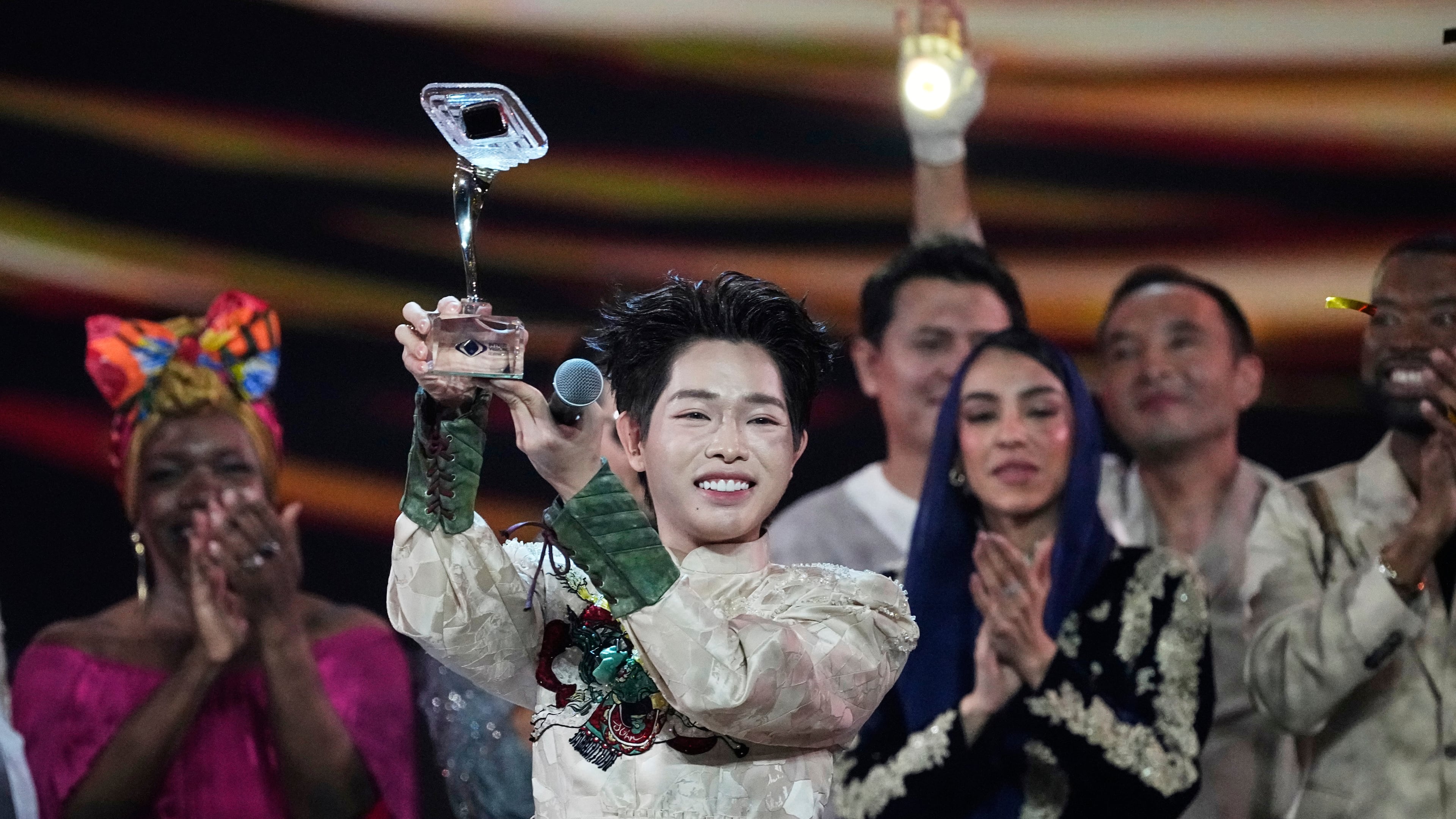 Vietnam's Duc Phuc holds his trophy after winning the International Music Competition "Intervision" at the Live Arena outside Moscow, Russia, Sunday, Sept. 21, 2025. (AP Photo/Alexander Zemlianichenko)