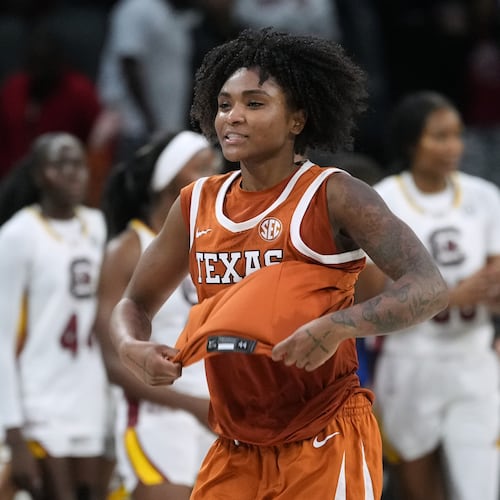 Texas guard Rori Harmon (3) celebrates the team's win over South Carolina in an NCAA college basketball game in the Players Era tournament in Las Vegas, Thursday, Nov. 27, 2025. (AP Photo/Eric Gay)