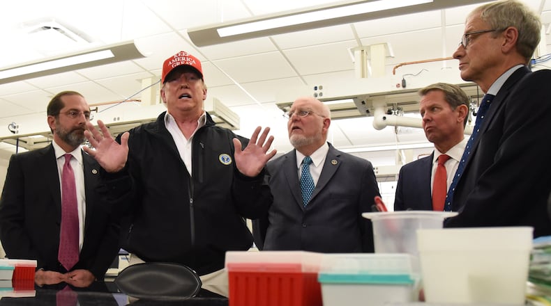 President Donald Trump visited the Atlanta-based U.S. Centers for Disease Control and Prevention on Friday to praise its work as the nation deals with a growing number of cases of coronavirus.