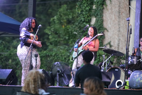 Gabriella “Guitar Gabby” Logan (right), whose rock fandom began when she was 11, is an Atlanta musician, lawyer and educator working to uplift more women of color rock musicians. (Courtesy of JohnLeeFrom1983/JayiKemp)
