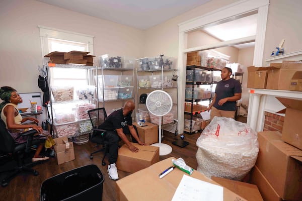 Ecoslay employees package wholesale shipments at the operations headquarters in Clarkston. (Natrice Miller/AJC)