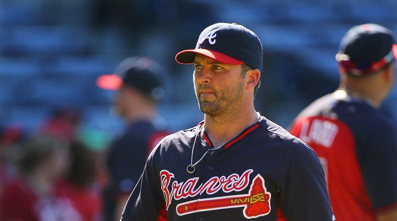Dan Uggla, who is not in tonight's lineup, heads to the locker room after team batting practice before playing the Cardinals in an MLB game on Monday, May 5, 2014, in Atlanta.