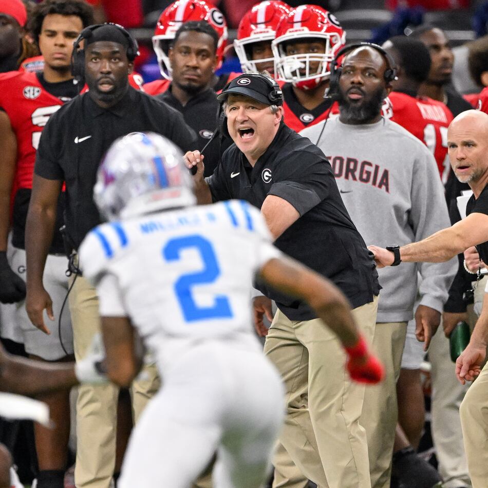 Georgia Bulldogs head coach Kirby Smart calls in a play against the Ole Miss Rebels during the second quarter of the NCAA College Football Playoff quarterfinal game at the Sugar Bowl in the Caesars Superdome, Thursday, Jan. 1, 2026, in New Orleans. (Hyosub Shin/AJC)