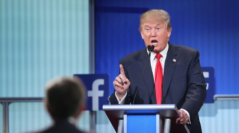 CLEVELAND, OH - AUGUST 06: Republican presidential candidate Donald Trump fields a question during the first Republican presidential debate hosted by Fox News and Facebook at the Quicken Loans Arena on August 6, 2015 in Cleveland, Ohio. The top ten GOP candidates were selected to participate in the debate based on their rank in an average of the five most recent political polls. (Photo by Scott Olson/Getty Images)