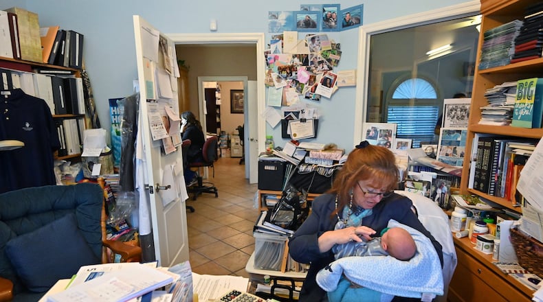 A staffer at Wayne Obstetrics and Gynecology in Jesup in southeast Georgia holds a tiny patient on Medicaid in 2020, during the pandemic. Staff photo by Hyosub Shin / Hyosub.Shin@ajc.com)