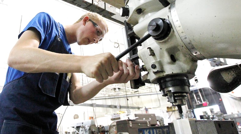 The author of a new book on rethinking the straight-to-college path says more high schools ought to offer apprenticeships that allow students to experience different kinds of work and workplaces to see what interests them. Here, an Ohio high school senior works as an apprentice for Dysinger Inc. in Dayton, Ohio. (Ty Greenlees / file photo)