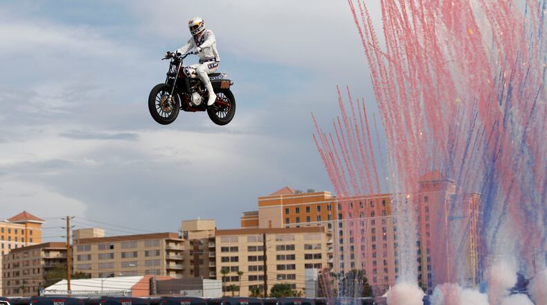 Travis Pastrana jumps a row of crushed cars on a motorcycle Sunday, July 8, 2018, in Las Vegas.