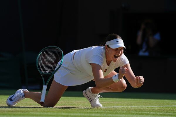 Amanda Anisimova of the U.S. celebrates winning the women's singles quarter finals match against Anastasia Pavlyuchenkova of Russia at the Wimbledon Tennis Championships in London, Tuesday, July 8, 2025.(AP Photo/Kin Cheung)