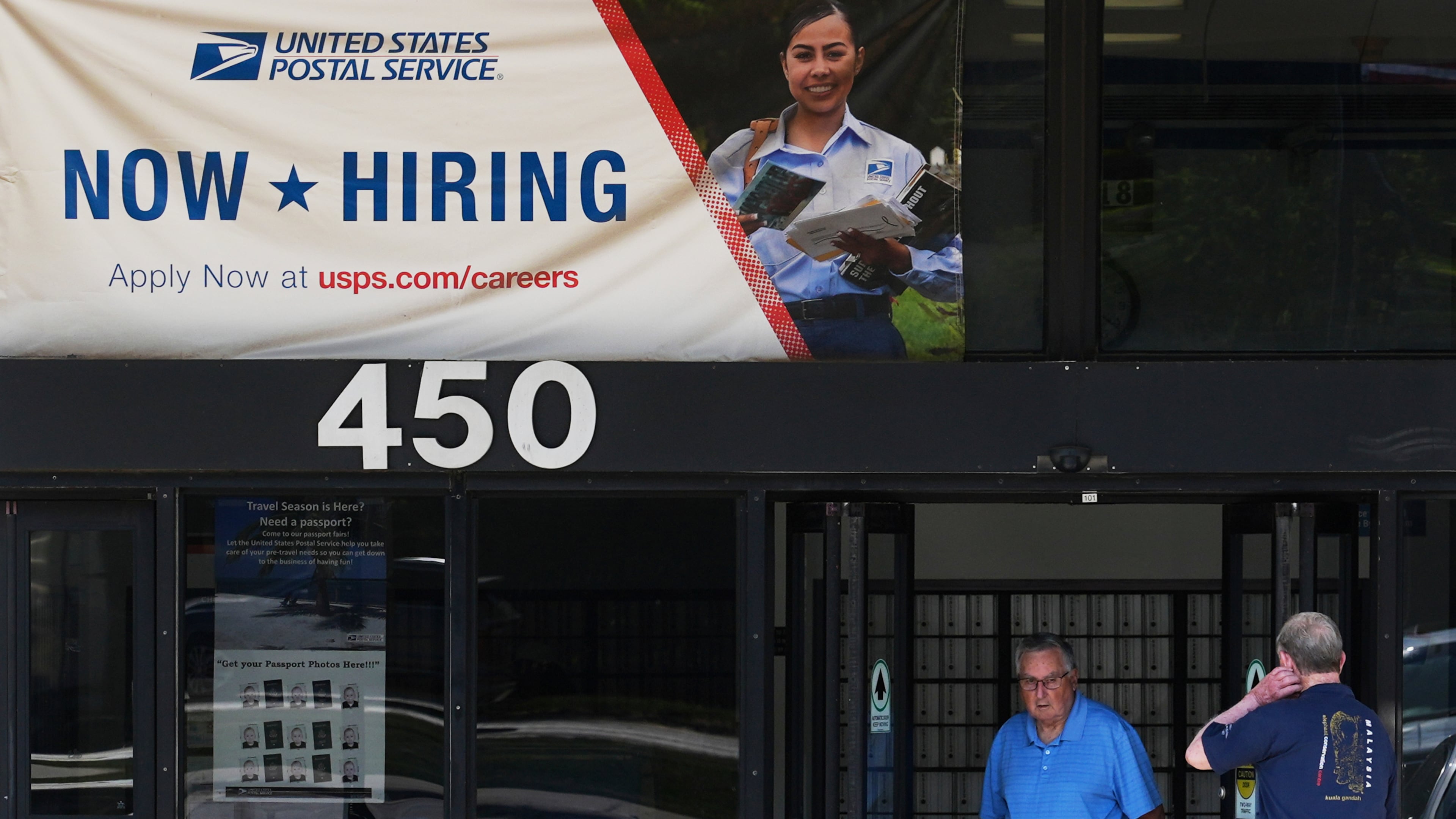 A hiring sign is displayed at a post office in Schaumburg, Ill., Thursday, Sept. 18, 2025. (AP Photo/Nam Y. Huh)