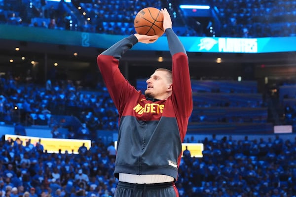Denver Nuggets center Nikola Jokic warms up before Game 7 in the Western Conference semifinals of the NBA basketball playoffs against the Oklahoma City Thunder, Sunday, May 18, 2025, in Oklahoma City. (AP Photo/Kyle Phillips)