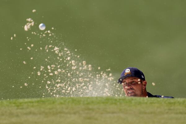 Bryson DeChambeau hits from the bunker on the seventh hole during the final round at the Masters golf tournament, Sunday, April 13, 2025, in Augusta, Ga. (AP Photo/David J. Phillip)