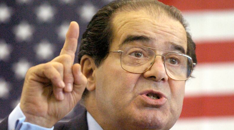 FILE - In this Wednesday, April 7, 2004 file photo, U.S. Supreme Court Justice Antonin Scalia speaks to Presbyterian Christian High School students in Hattiesburg, Miss. On Saturday, Feb. 13, 2016, the U.S. Marshall's Service confirmed that Scalia has died at the age of 79. (Gavin Averill/The Hattiesburg American via AP)