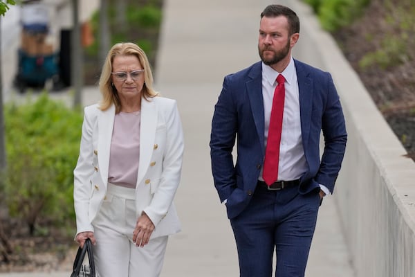 Cade Cothren, the former chief of staff to former Tennessee House Speaker Glen Casada, right, arrives at the federal courthouse with his attorney Cynthia Sherwood, right, Tuesday, April 22, 2025, in Nashville, Tenn. (AP Photo/George Walker IV)