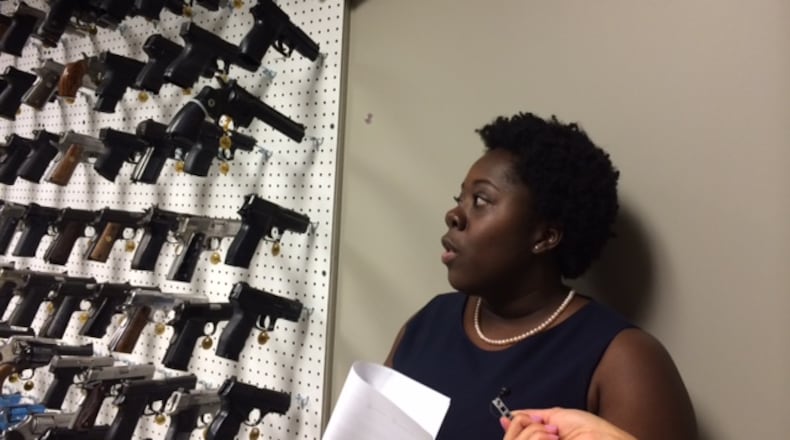 Candace Walker, the new director of the Atlanta Police Department forensic lab, in the gun room — which keeps a multitude of firearms to help with identifying what kind of weapon was used in a crime. (Steve Visser / svisser@ajc.com)