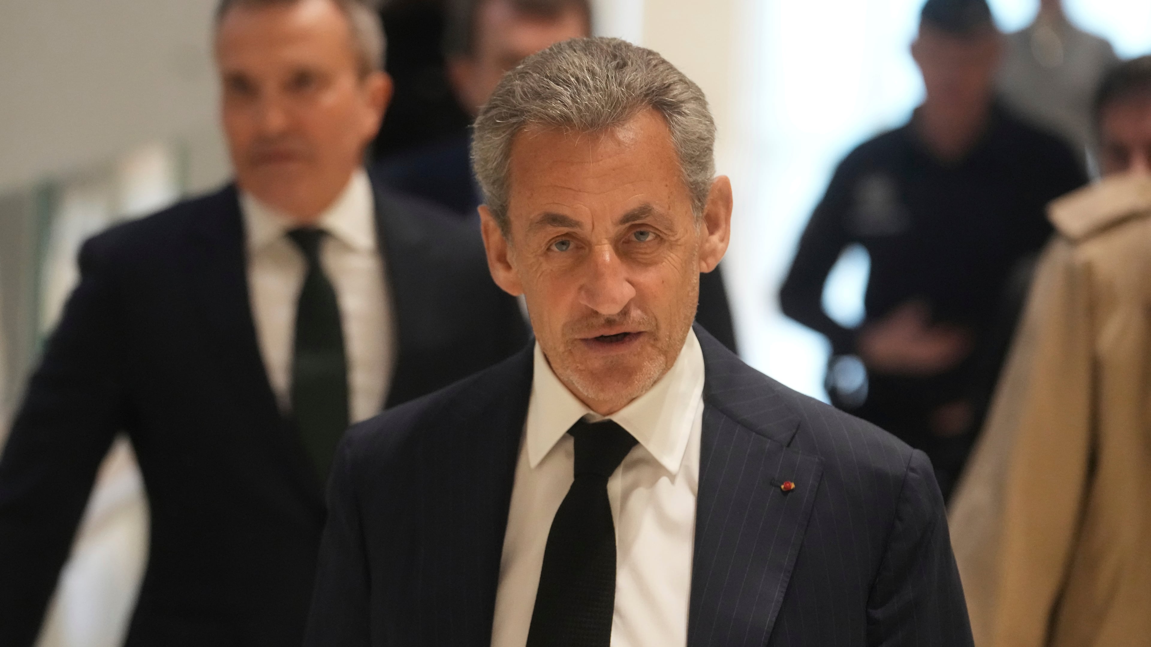 FILE - Former French President Nicolas Sarkozy arrives as he goes on trial over alleged illegal financing of his 2007 presidential campaign by the government of late Libyan leader Moammar Gadhafi, Monday, Jan. 6, 2025 in Paris. (AP Photo/Thibault Camus, File)