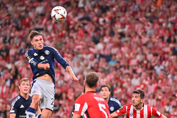 Manchester United's Manuel Ugarte heads the ball during the Europa League semifinal first leg soccer match between Athletic Bilbao and Manchester United at the San Mames stadium in Bilbao, Spain, Thursday, May 1, 2025. (AP Photo/Miguel Oses)