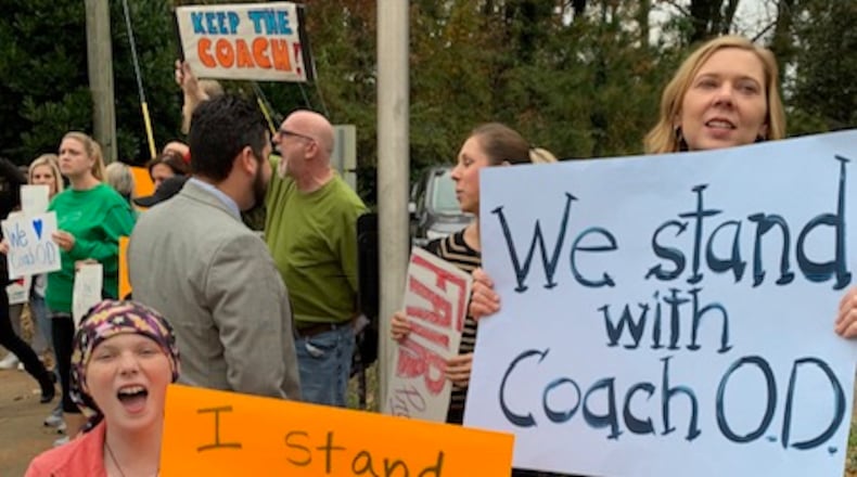 Henderson Mill Elementary parents and students have rallied for beloved PE coach James O'Donnell,  suspended in November after a parent complained about how he disciplined her son.