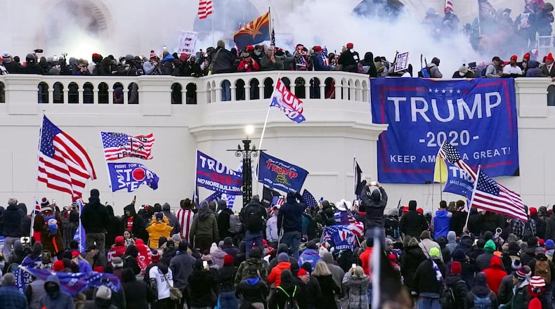 FILE - Rioters storm the West Front of the U.S. Capitol Jan. 6, 2021, in Washington. (AP Photo/John Minchillo, File)