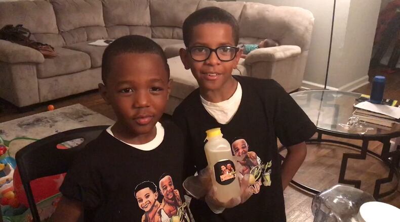 Ja'Den St. Hilaire (left), 7, and his brother Anthony Roberson, 10 are the owners of Brown Boys Lemonade. / Photo by Ligaya Figueras