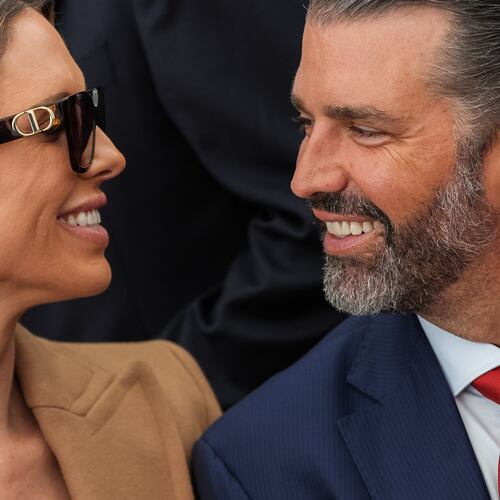 Donald Trump Jr. and his wife Bettina Anderson look at each other while waiting for President Donald Trump to speak at Deerfield Residence, the residence of the U.S. Ambassador to Ireland Edward S. Walsh, Saturday, Sept. 12, 2026, in Dublin. (AP Photo/Julia Demaree Nikhinson)