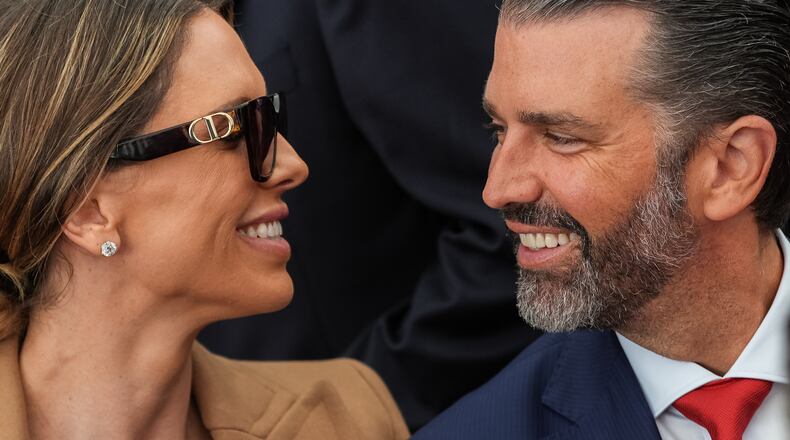 Donald Trump Jr. and his wife Bettina Anderson look at each other while waiting for President Donald Trump to speak at Deerfield Residence, the residence of the U.S. Ambassador to Ireland Edward S. Walsh, Saturday, Sept. 12, 2026, in Dublin. (AP Photo/Julia Demaree Nikhinson)