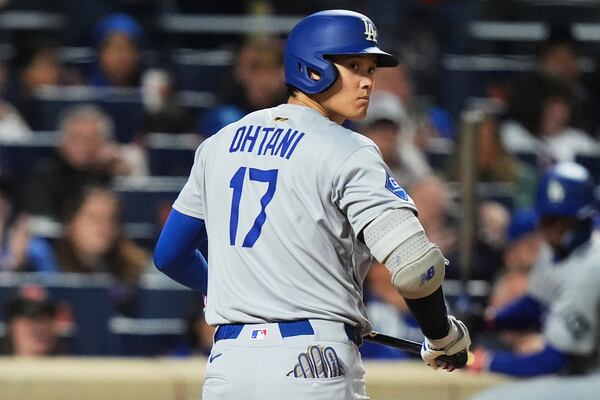 Los Angeles Dodgers' Shohei Ohtani, of Japan, reacts after striking out during the eighth inning of a baseball game against the New York Mets Saturday, May 24, 2025, in New York. (AP Photo/Frank Franklin II)