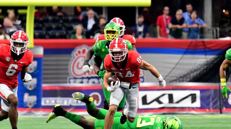 Georgia wide receiver Ladd McConkey runs for yards after the catch against Oregon on Saturday in Atlanta. (Photo credit Perry McIntyre)