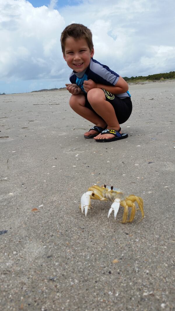Angela May's son exploring the Dewees Beach.