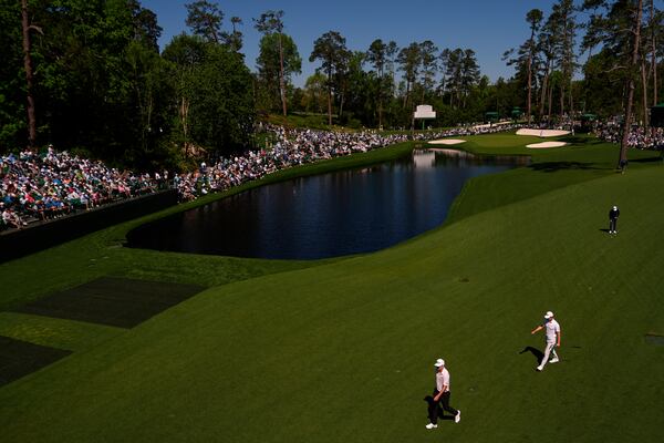 Matt McCarty and Maverick McNealy, right, walks up the 15th fairway during a practice round at the Masters golf tournament, Tuesday, April 8, 2025, in Augusta, Ga. (AP Photo/Julia Demaree Nikhinson)