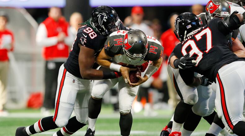 Falcons rookie defensive end Takk McKinley sacks Ryan Fitzpatrick of the Buccaneers in the second half at Mercedes-Benz Stadium on November 26 in Atlanta.