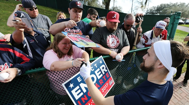 Braves outfielder Ender Inciarte cools down from a morning batting practice by signing a few autographs on the way back to the clubhouse. (Curtis Compton/ccompton@ajc.com)