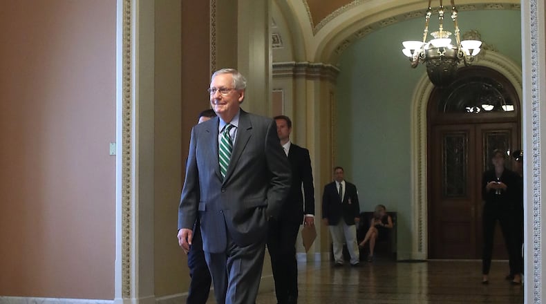 Senate Majority Leader Mitch McConnell, R-Ky., walks to his office on Capitol Hill on Thursday. This morning Senate GOP lawmakers are expected to get the first look at the health care bill that will replace the Affordable Care Act. Mark Wilson/Getty Images