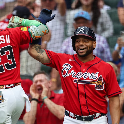 Atlanta Braves' Michael Harris II (23) reacts with Dominic Smith, right, after hitting a two-run home run in the second inning of a baseball game against the New York Mets, Friday, July 3, 2026, in Atlanta. (AP Photo/Colin Hubbard)