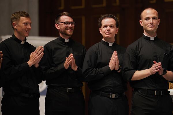 From left, the Rev. Joesph Connor, the Rev. Tim Banach, the Rev. John Meyerhofer, and the Rev. Mike Sampson, attend rehearsal for their ordination Mass at the Cathedral of Saint Thomas More in Arlington, Va., on Friday, June 6, 2025. (AP Photo/Jessie Wardarski)