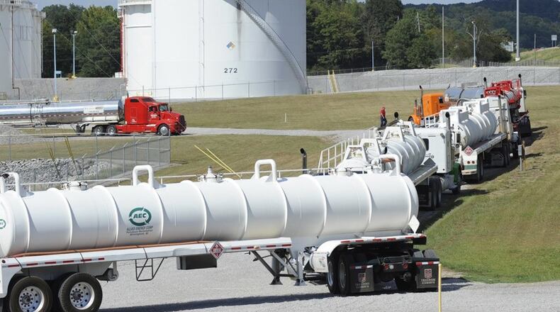 Tanker trucks line up at a Colonial Pipeline facility in Pelham, Ala. The Alpharetta company’s 5,500-mile network is the nation’s biggest. (AP Photo/Jay Reeves)