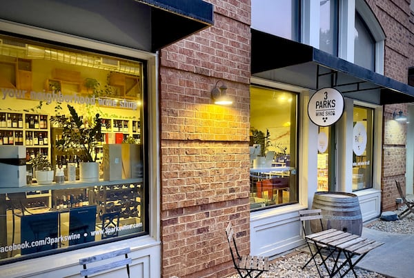 The exterior of a wine shop with a sing that says 3 Parks