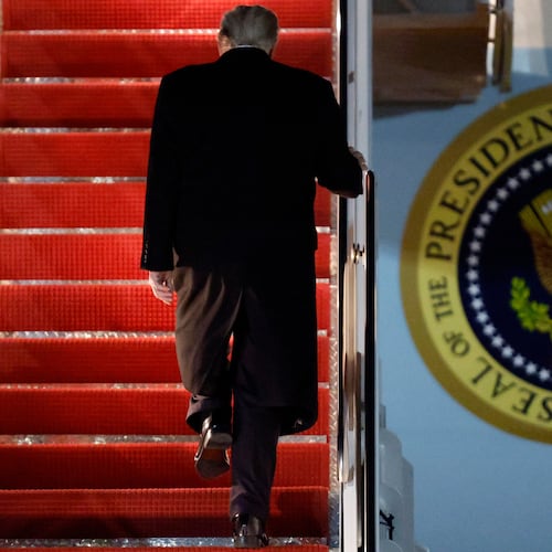 President Donald Trump walks up the stairs of Air Force One as he boards upon his arrival at Joint Base Andrews, Md., Friday, Nov. 7, 2025, en route to his Mar-a-Lago estate in Palm Beach, Fla. (AP Photo/Luis M. Alvarez)