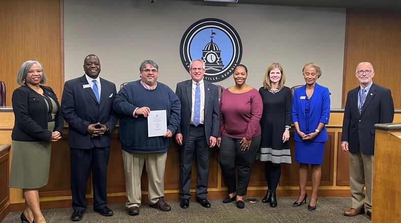 Lawrenceville staff is recognized for their contribution toward the Distinguished Budget Presentation Award for the fiscal year 2023 budget. Pictured L-R are Councilwoman Victoria Jones, Councilman Austin Thompson, Keith Lee, Chief Financial Officer, Mayor David Still, Budget Officer Shereese Durham, Community Relations Director & Chief Communications Officer Melissa Hardegree, Councilwoman Marlene Taylor-Crawford, and Councilman Glenn Martin. COURTESY CITY OF LAWRENCEVILLE