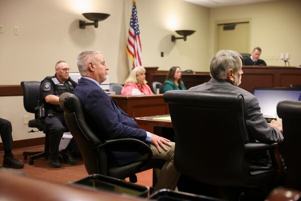 Colin Gray (second from left), the father of Apalachee High School shooting suspect Colt Gray, stands trial in connection with his son's alleged crimes. (Jason Getz/AJC)