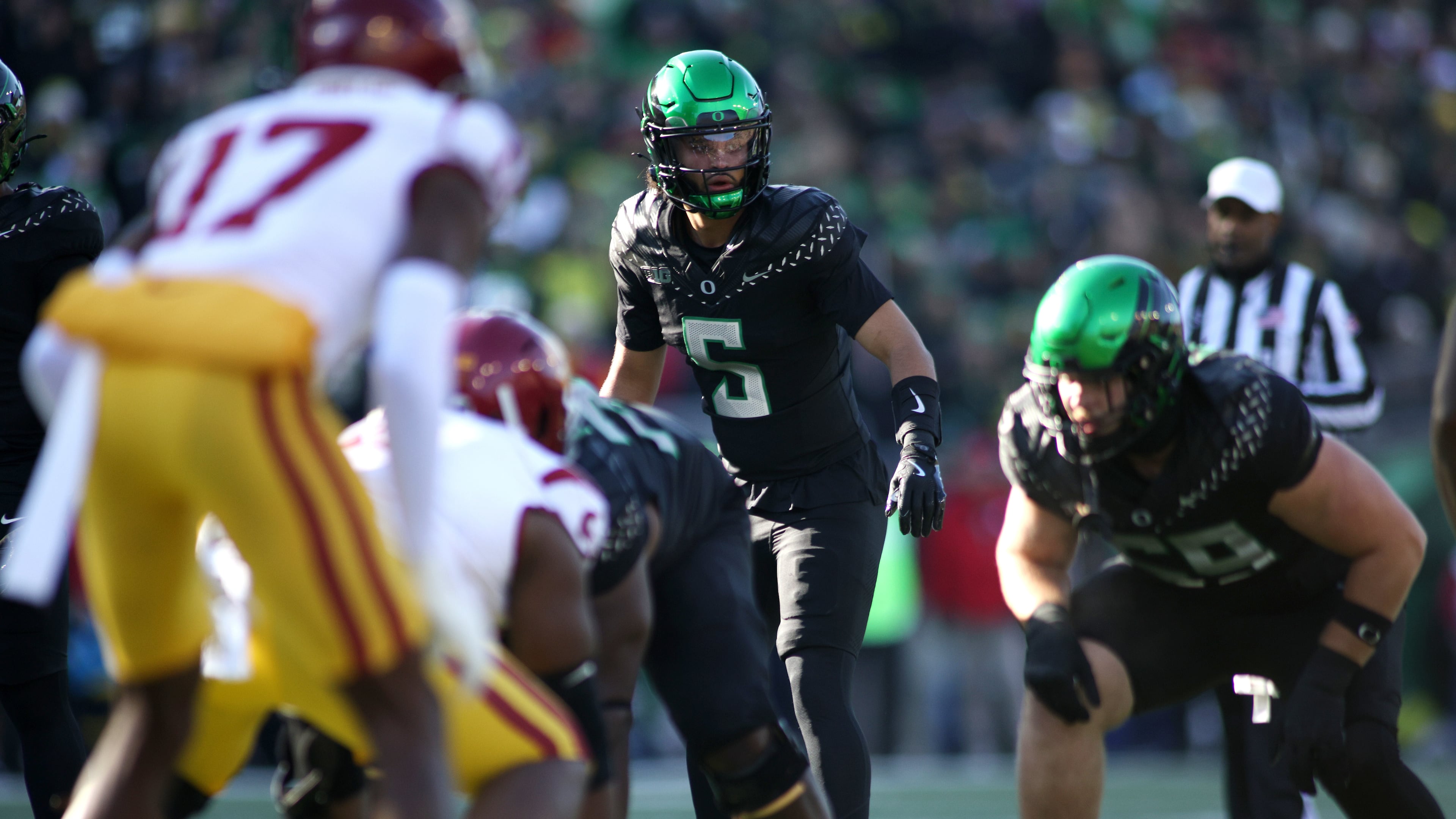 Oregon quarterback Dante Moore (5) calls instructions during the first half of an NCAA college football game against Southern California, Saturday, Nov. 22, 2025, in Eugene, Ore. (AP Photo/Lydia Ely)